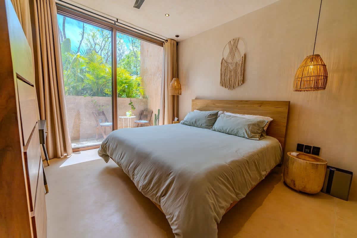Bright and comfortable bedroom offering a quiet retreat after a day of adventure in Tulum.