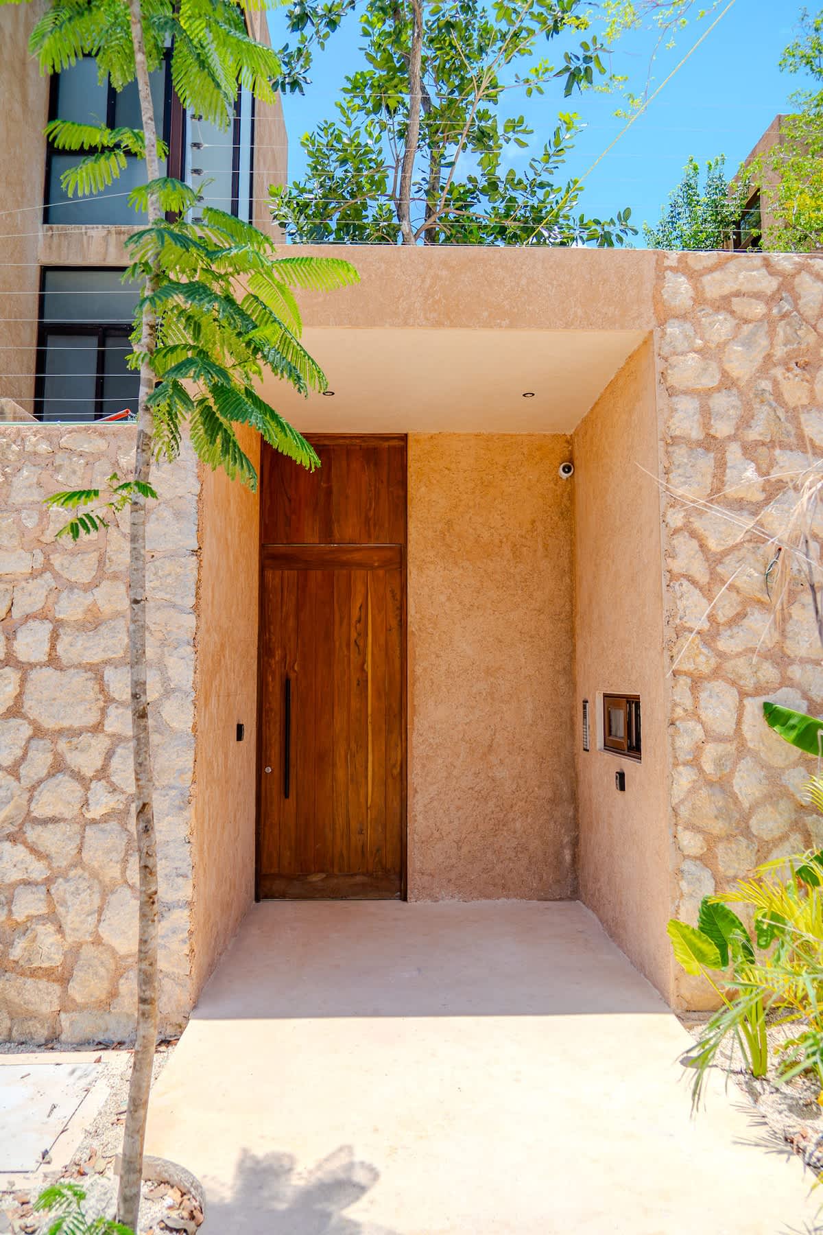 Beautiful jungle-style architecture with tropical landscaping, creating a serene and authentic Tulum atmosphere.