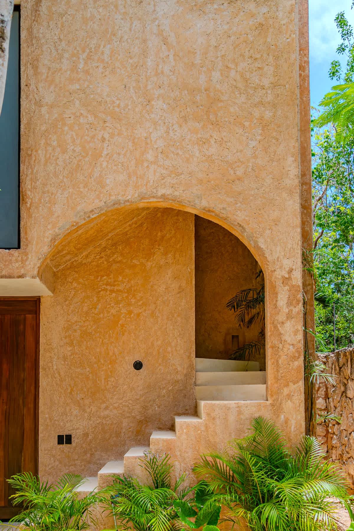 Beautiful jungle-style architecture with tropical landscaping, creating a serene and authentic Tulum atmosphere.