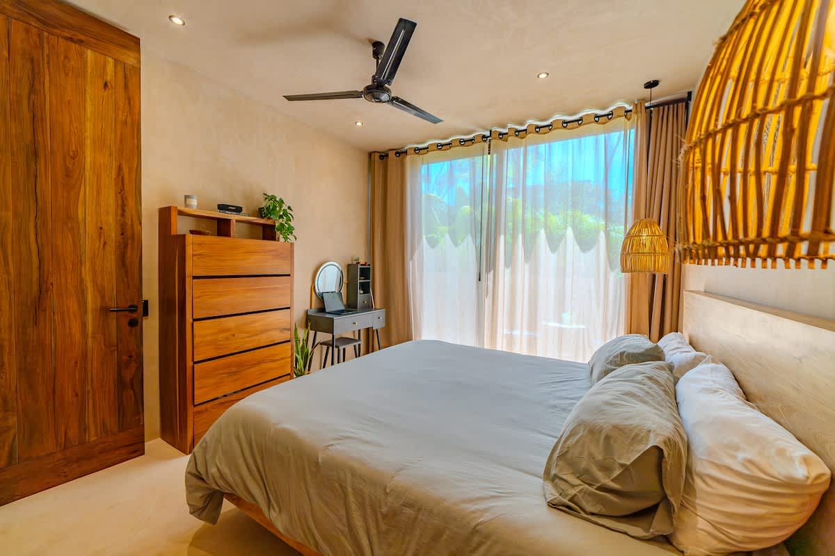 Bright and comfortable bedroom offering a quiet retreat after a day of adventure in Tulum.