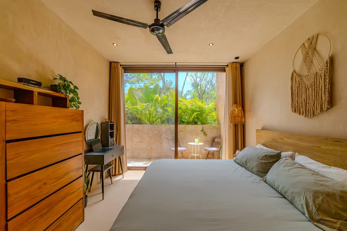 Bright and comfortable bedroom offering a quiet retreat after a day of adventure in Tulum.