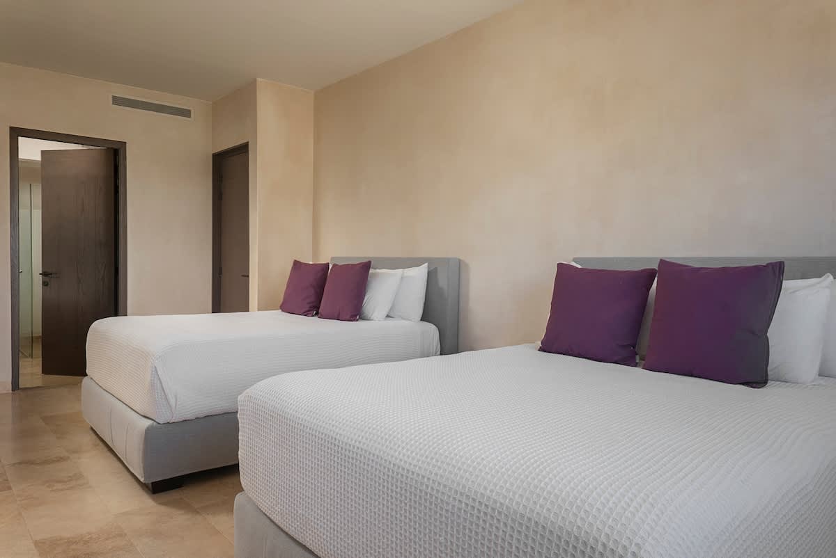 Bedroom #3 features two comfortable queen beds and beautiful jungle views, creating the perfect relaxing retreat.
