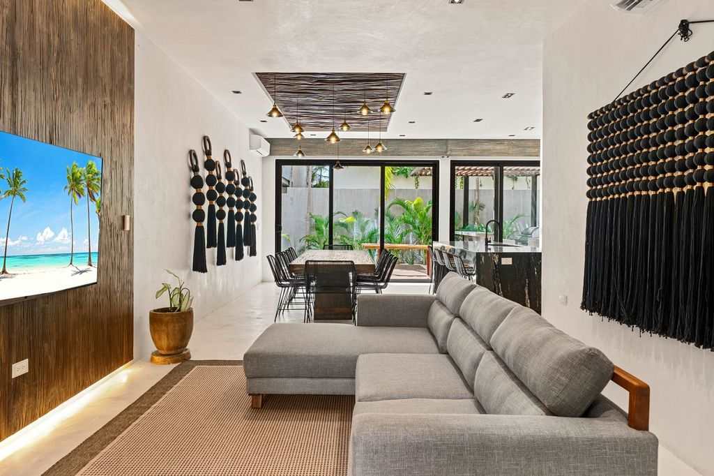 Enjoy a bright and welcoming living area, complete with a comfortable sofa and TV for peaceful nights in.