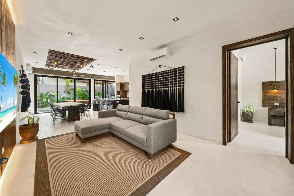 Enjoy a bright and welcoming living area, complete with a comfortable sofa and TV for peaceful nights in.