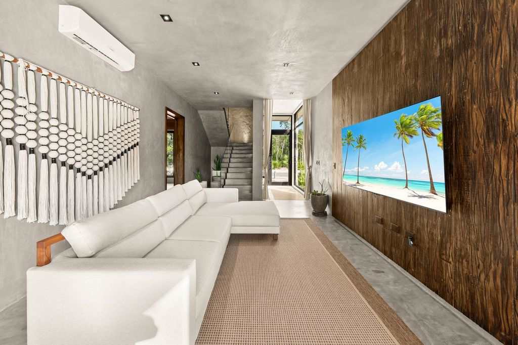 Bright and inviting living room, thoughtfully designed with a comfortable sofa and TV for cozy moments and relaxation