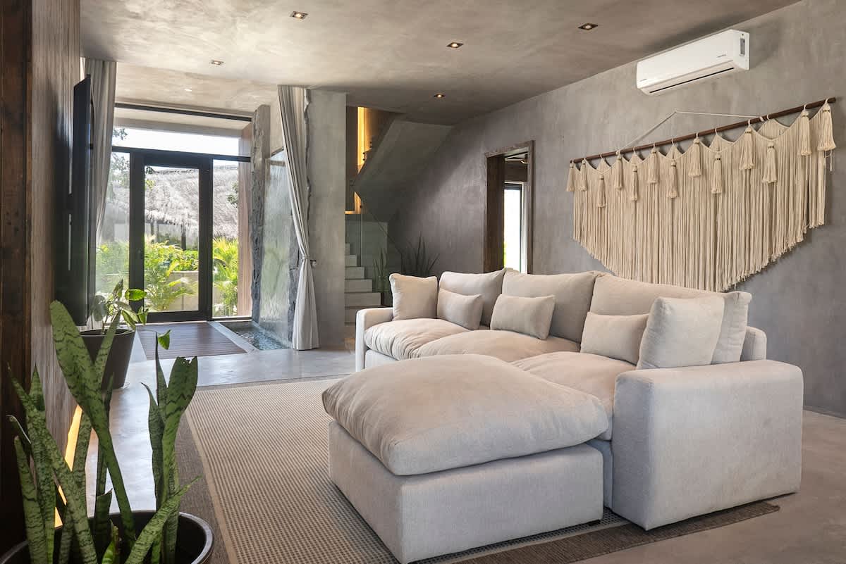 Enjoy a bright and welcoming living area, complete with a comfortable sofa and TV for peaceful nights in.