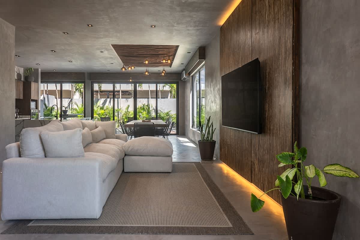 Enjoy a bright and welcoming living area, complete with a comfortable sofa and TV for peaceful nights in.