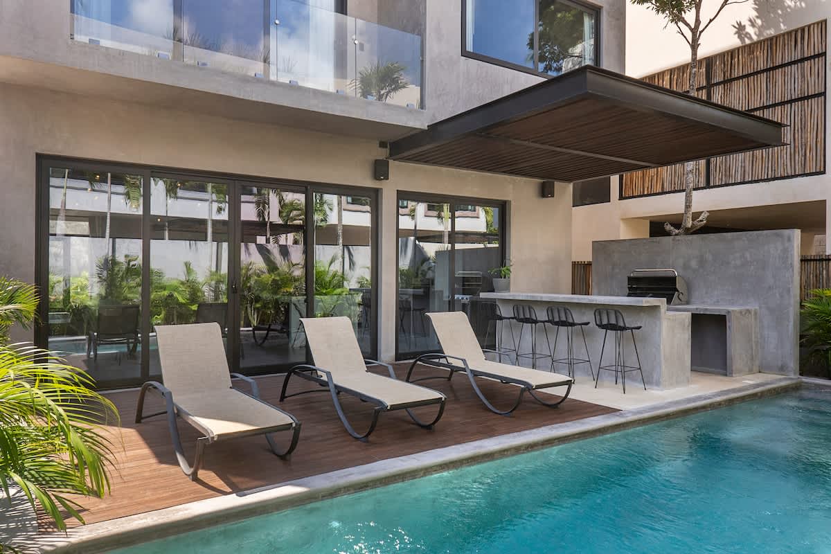 Pool #1 -- Enjoy the first pool area on the ground floor, complete with a BBQ space for memorable meals outdoors