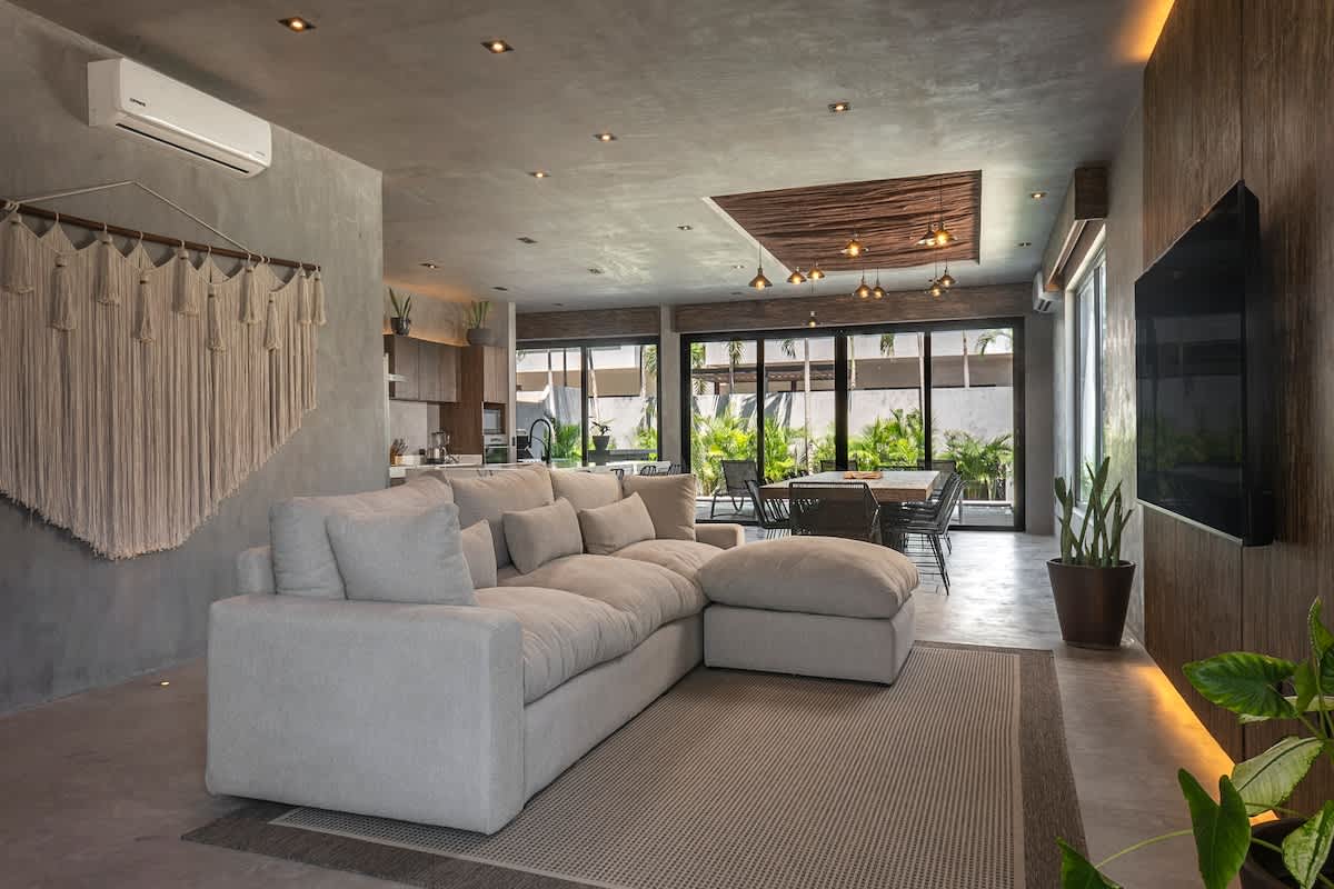 Enjoy a bright and welcoming living area, complete with a comfortable sofa and TV for peaceful nights in.