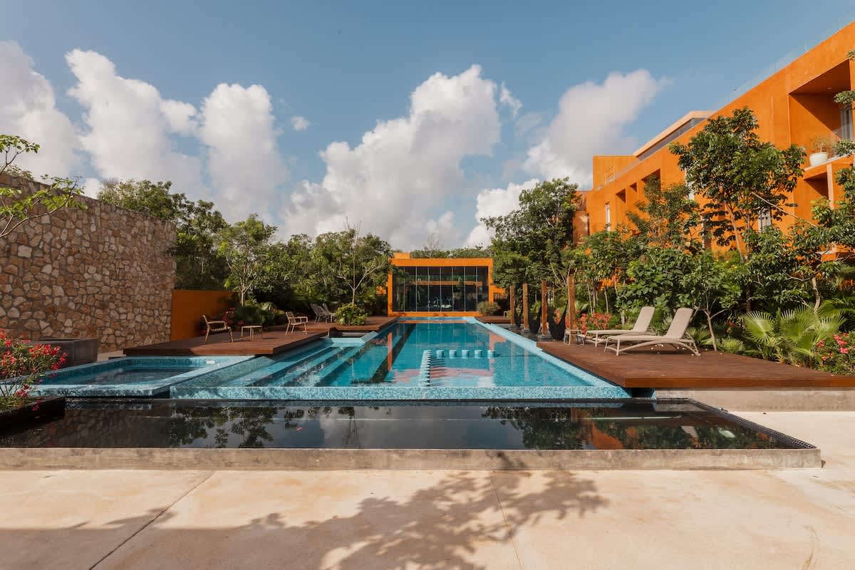 Resort-Style Amenities: Enjoy multiple swimming pools and relaxing hammocks throughout the Kune complex—the perfect places to unwind and recharge.
