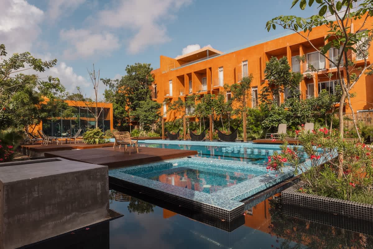 Shared Semi-Olympic Pool: Enjoy a beautiful semi-Olympic pool surrounded by lush tropical gardens.