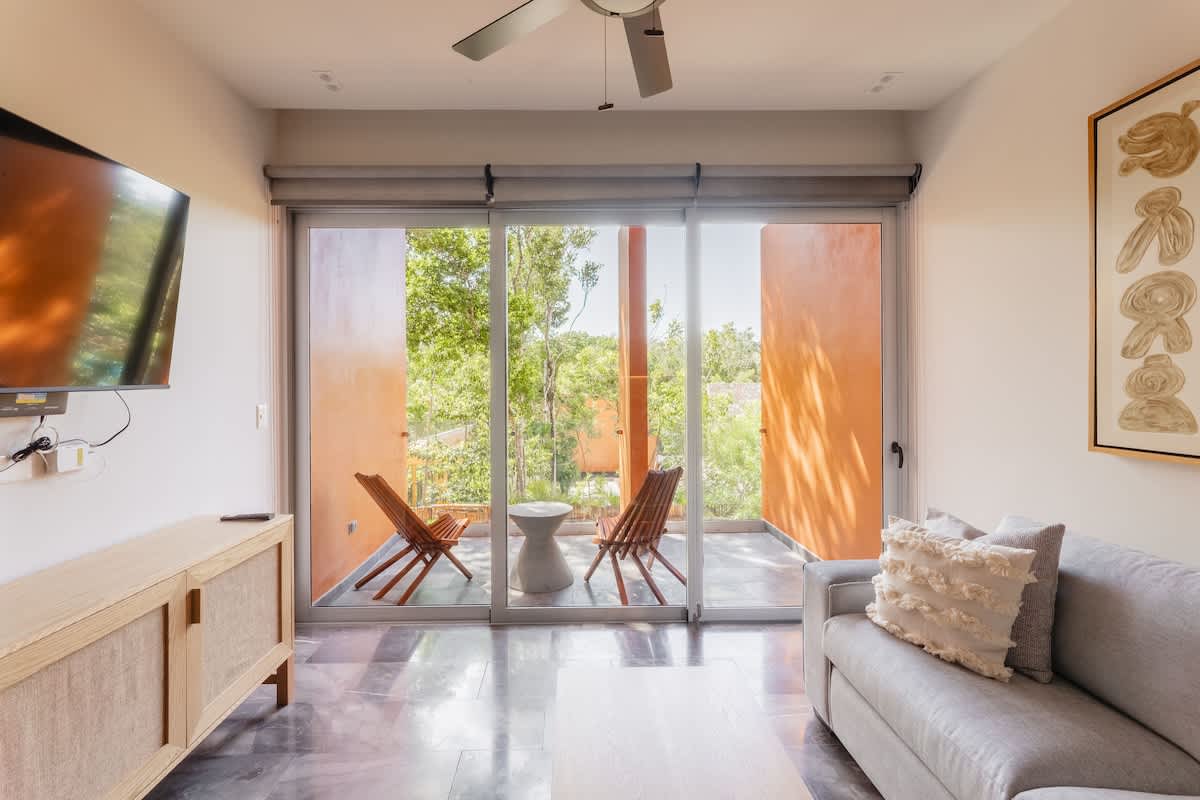 Living Area--Relax in a cozy, bright living space featuring a comfortable sofa bed.