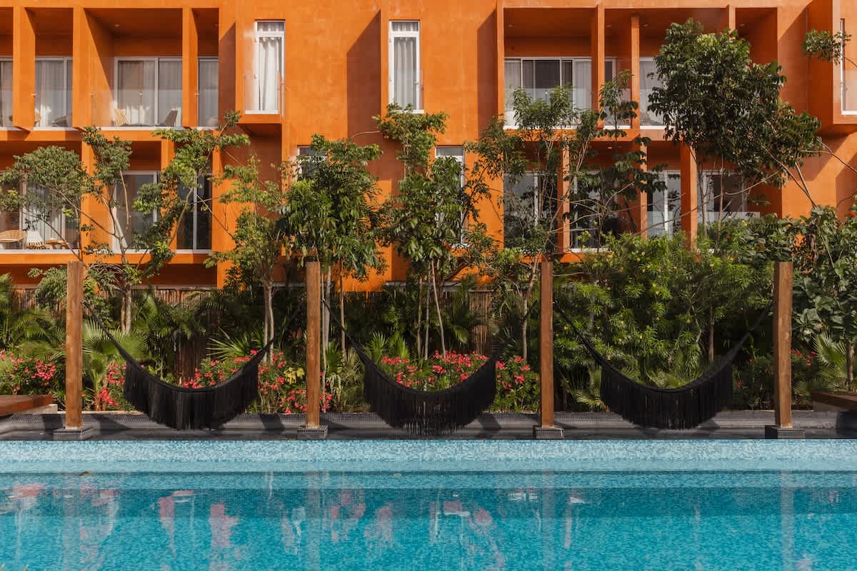 Resort-Style Amenities: Enjoy multiple swimming pools and relaxing hammocks throughout the Kune complex—the perfect places to unwind and recharge.