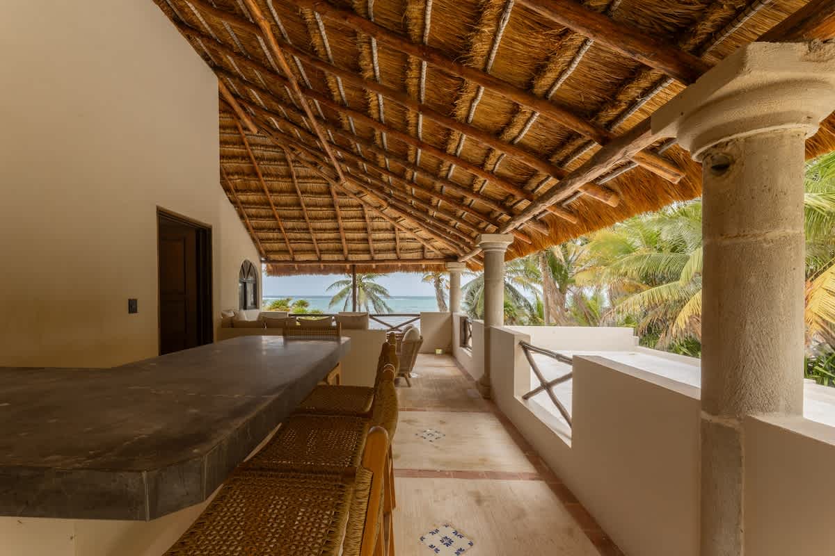 Private terrace with stunning ocean views, ideal for gathering with family and friends.