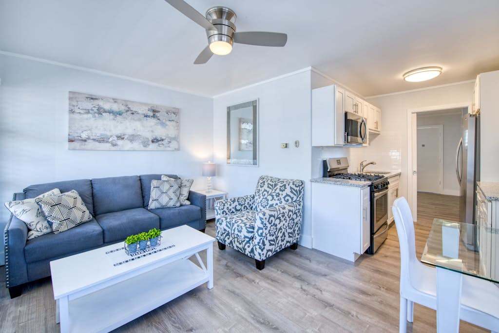 Lakefront corner condo with canoes, resort pool, tennis & firepit - dogs welcome