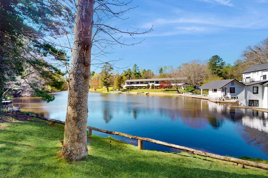 Dog-friendly lakefront condo with pool, canoes, & WiFi - in a perfect location