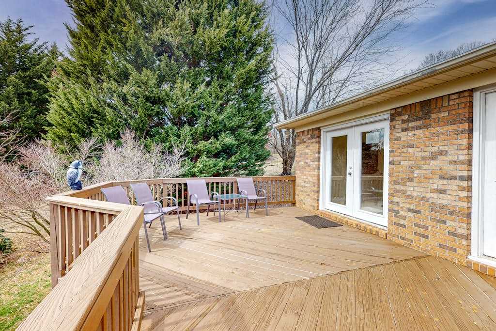 Warm & inviting upper-level guest suite with deck, shared W&D, central AC
