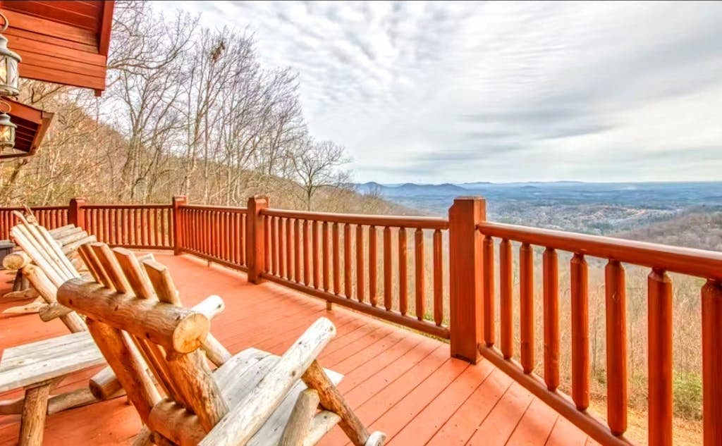 Rustic mountain-view home with deck, fire pit, hot tub, fireplace, & game room