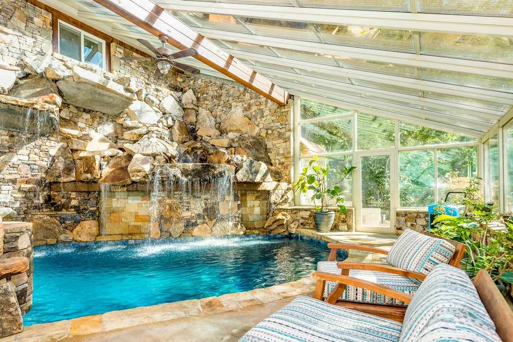 Riverside opulence with game room, private heated pool, hot tub & firepit