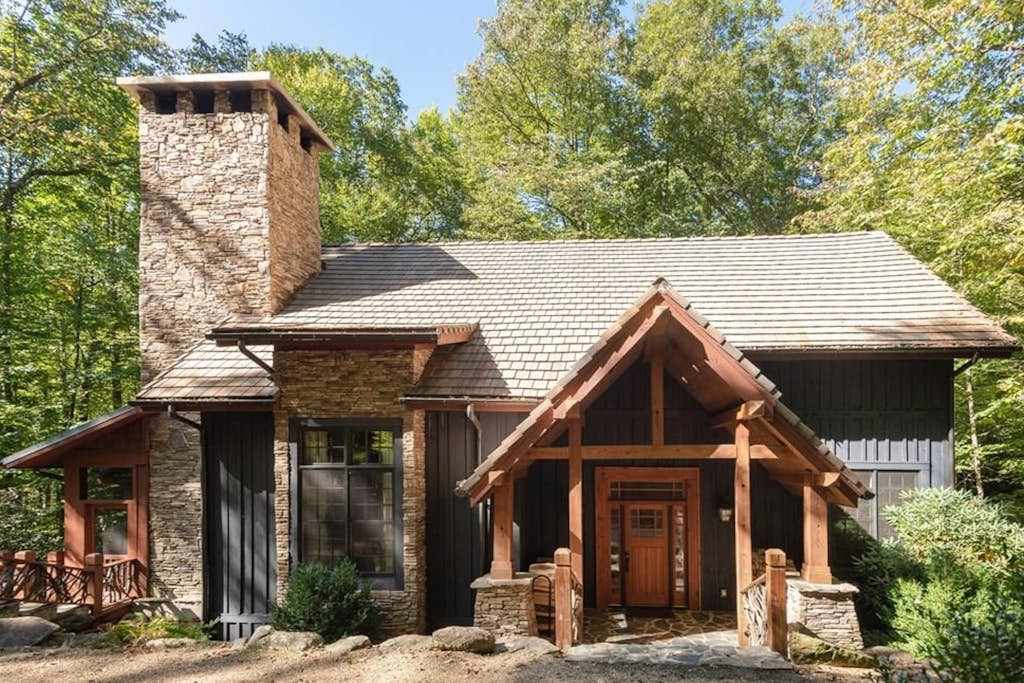 Fairy tale home among the trees with a hot tub, multiple decks & fireplaces