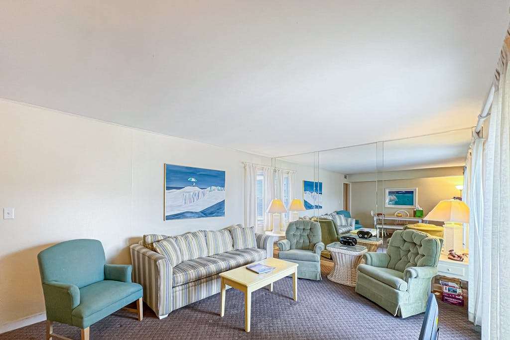 2nd floor Sunspot condo steps from beach with a balcony an outdoor shower a washer & dryer & AC