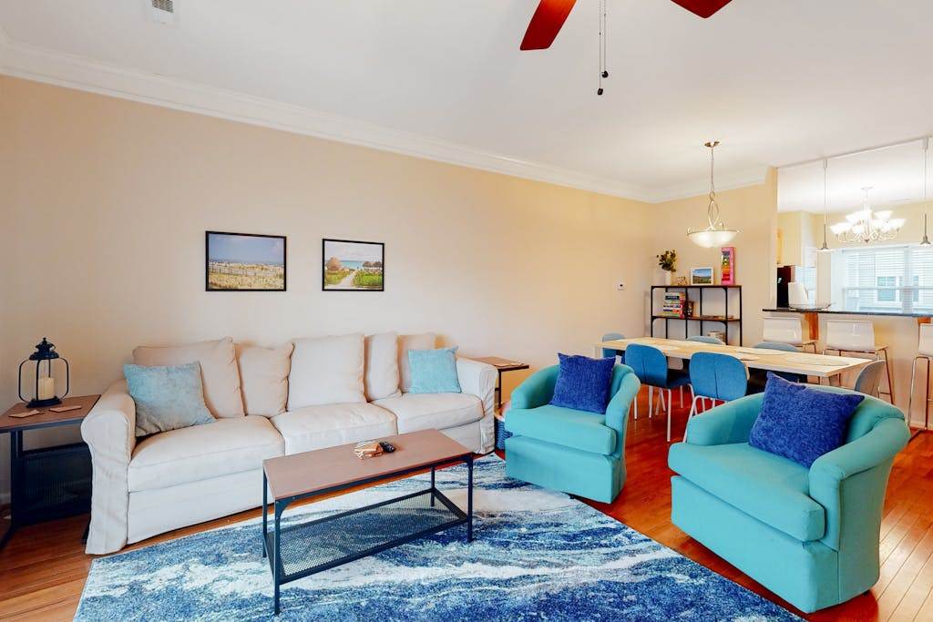Rehoboth Crossing townhouse with pool & gym a balcony & patio with a grill also including a washer & dryer & bikes