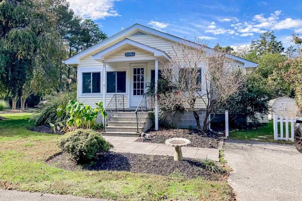 Town of Rehoboth Beach home in a great location with yard & 3 season room