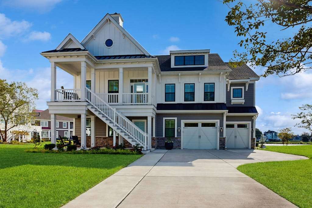 Elegant coastal retreat with golf course & pond views & bayside beach