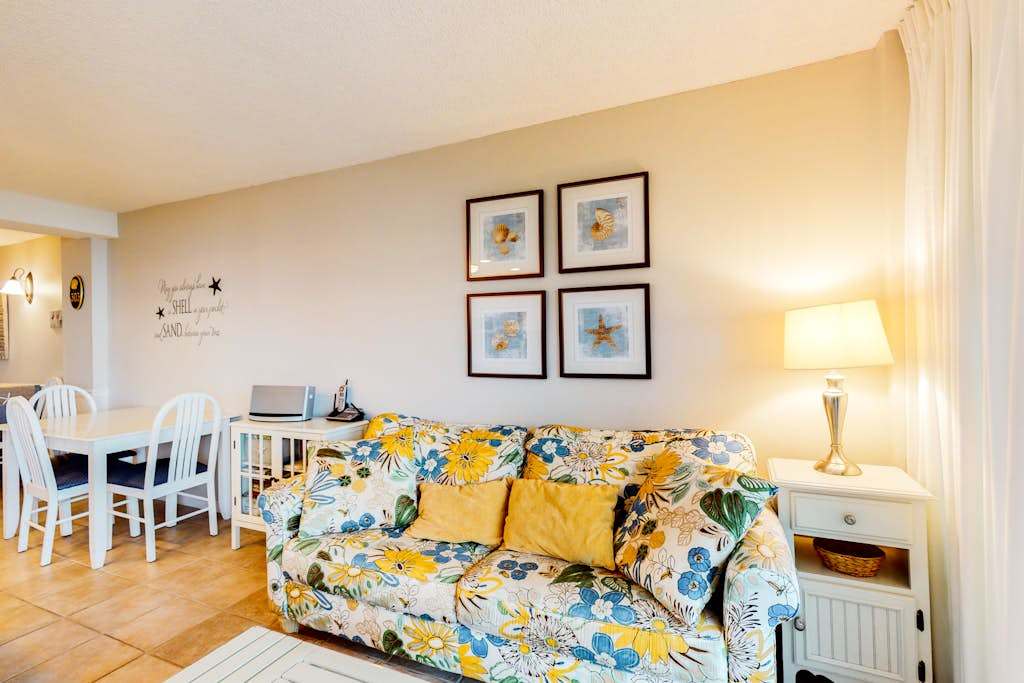 Sea Colony 3rd floor condo with elevator shared tennis court & gym with an ocean view