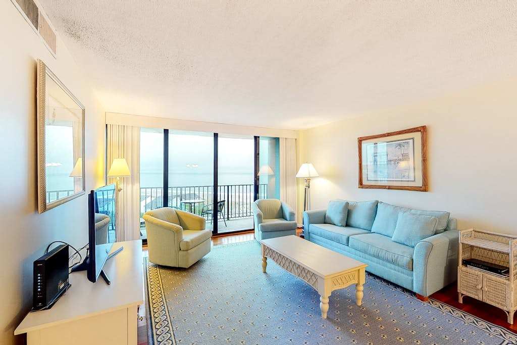 Sea Colony 6th floor condo with pool shared sauna & gym partial ocean view