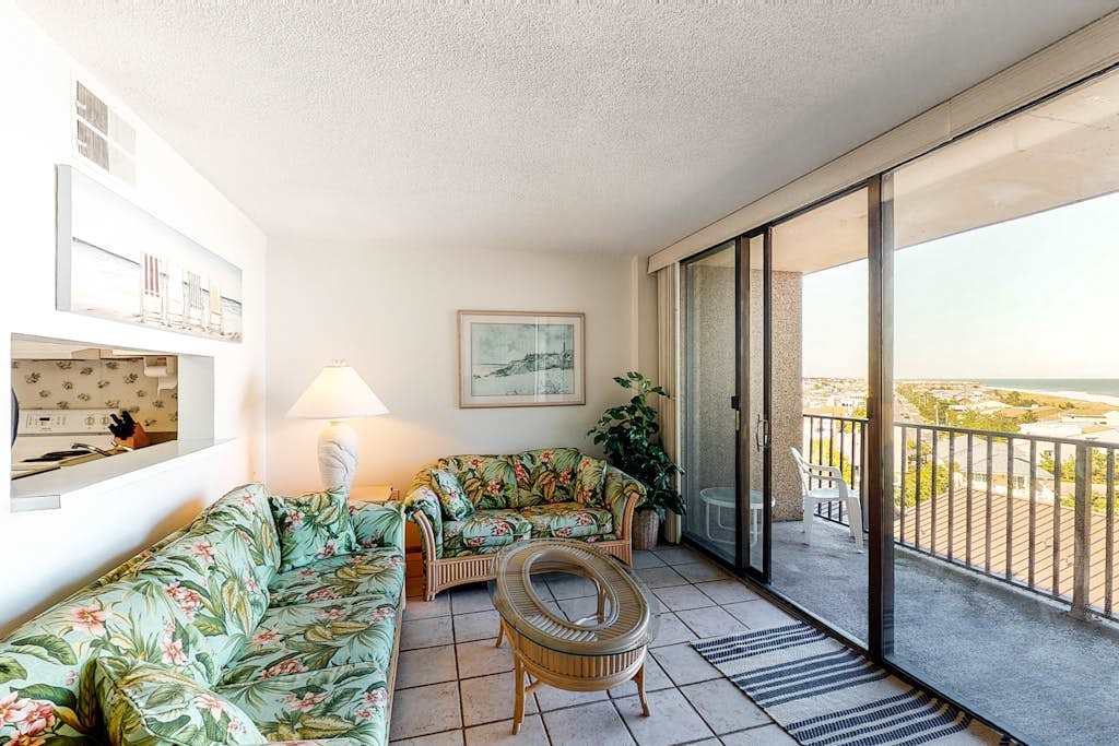 Sea Colony 6th floor condo with shared gym basketball court with an partial ocean view