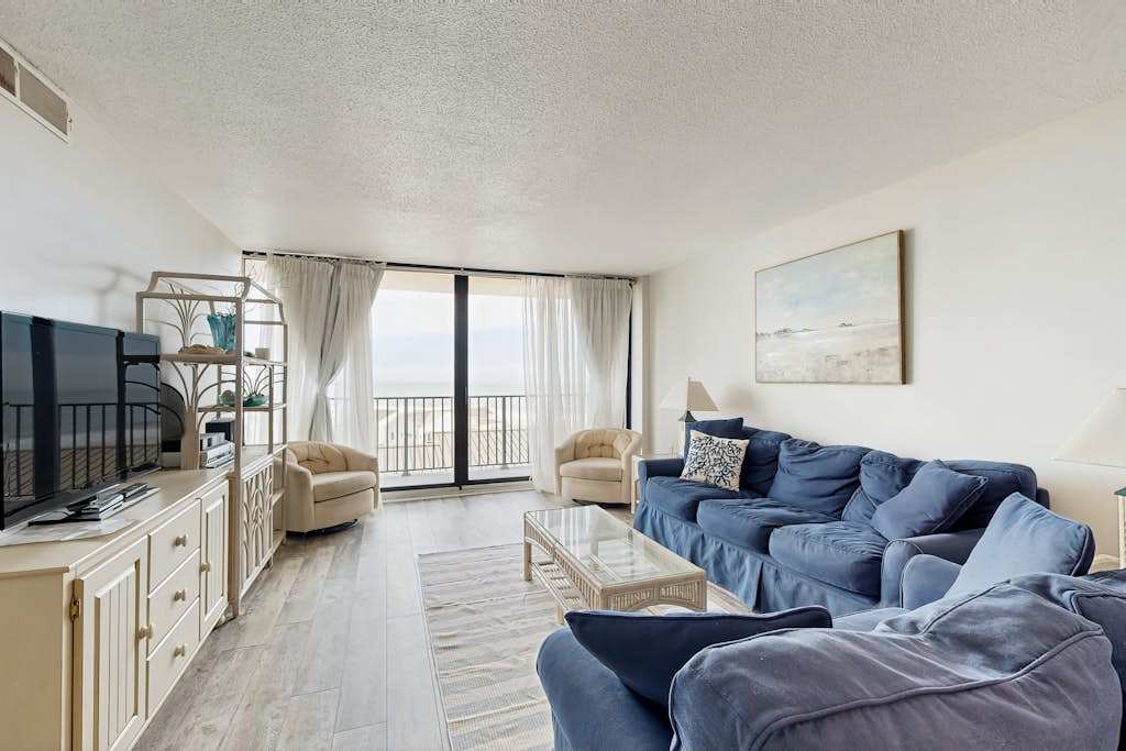 Sea Colony 5th floor condo with shared basketball court & sauna partial ocean view