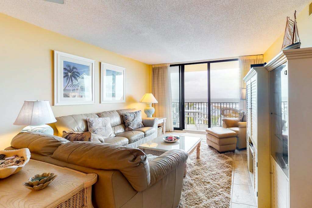 Sea Colony 5th floor condo with balcony gym basketball court & a partial ocean view
