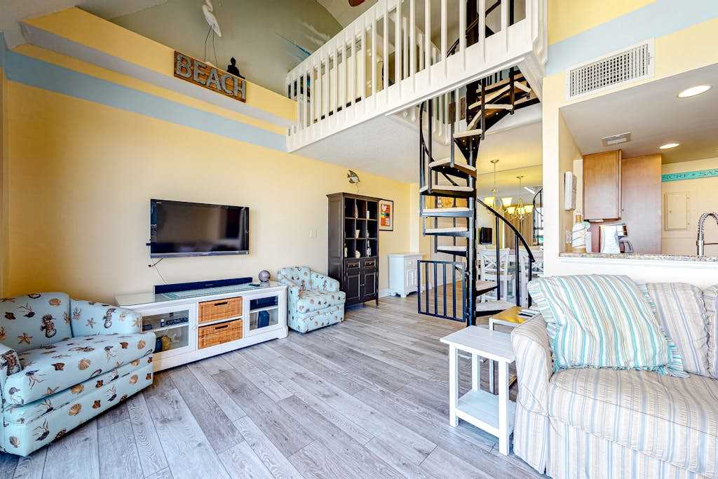 Fun lofted escape near the beach with private balcony ocean views WiFi & AC