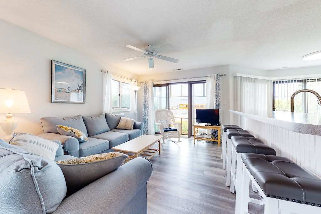 East of the Sun condo with central AC washer & dryer & shared pool under 1 mile to beach