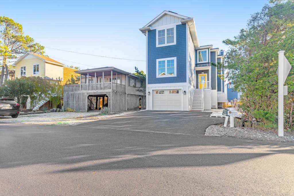 Town of Bethany Beach home with a fireplace & outdoor living near beach