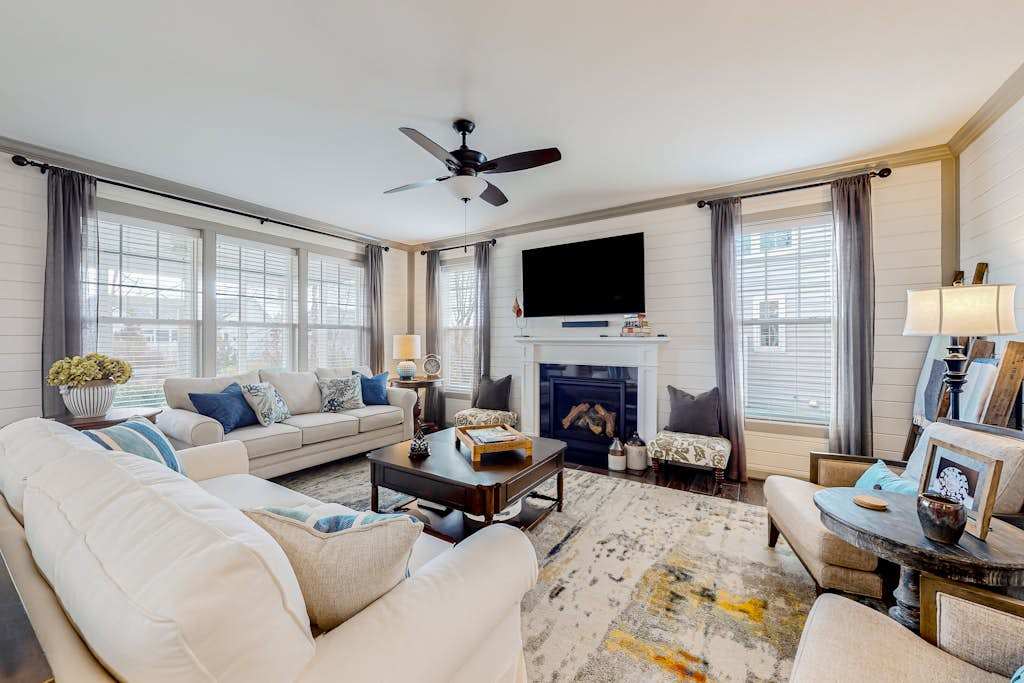 Millville by the Sea home with sunroom fireplace & great amenity add ons