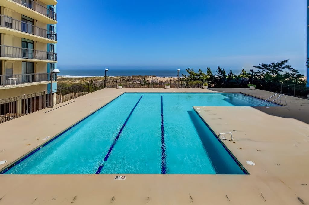 Ocean view condo with balcony & shared pool, tennis & game room - steps to beach