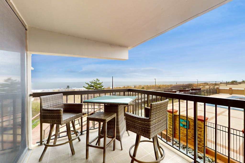 Ocean-view 1st-floor condo with electric fireplace, pools & gym