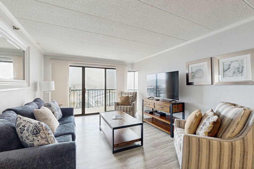 Beachy Getaway Steps From Water with Shared Pool, WiFi, AC, & Private washer & dryer