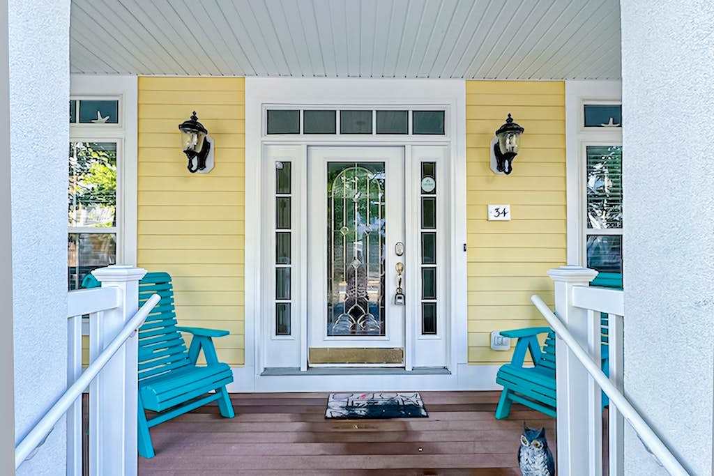 Large, welcoming house steps from bay with water view, WiFi, AC, shared pool, & washer & dryer