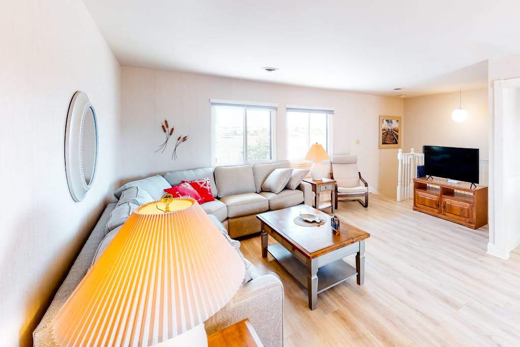 Cozy canal-side condo with pool, bay views, central AC, & deck - walk to beach