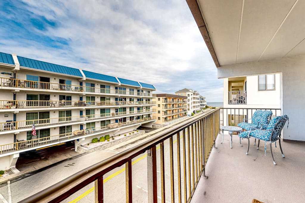 3rd-floor condo near the beach with balcony, partial ocean views, & central AC