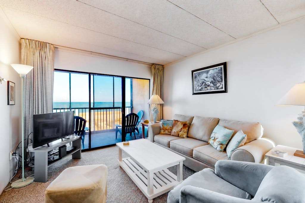 Beachfront End Condo with Private Balcony, Central AC, washer & dryer, Free WiFi