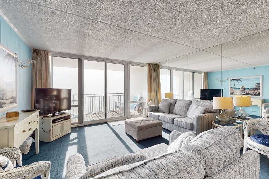 Convenient beachfront condo with fast WiFi, pools, sauna, gym, & central AC