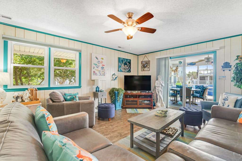 Beach-Themed Canal-Front Home with Private Deck, Dock, Water Views, Free WiFi
