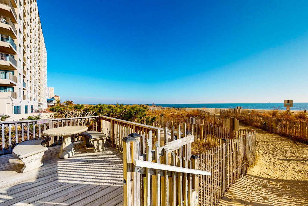 Open & charming home in oceanfront building with indoor pool, balconies, & AC