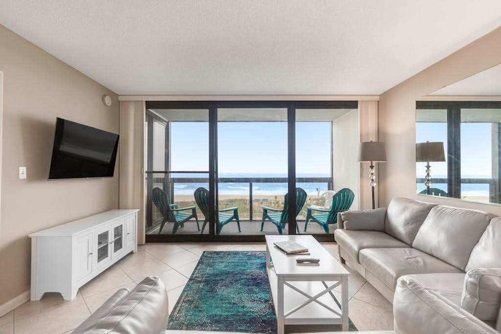 Convenient beachfront condo with views, balcony, pools, gym & game room