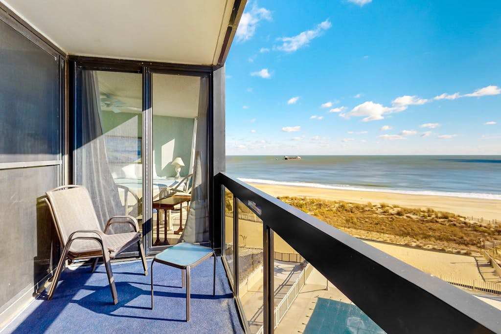 Unparalleled beachfront condo with balcony, pools, game room, gym & sauna