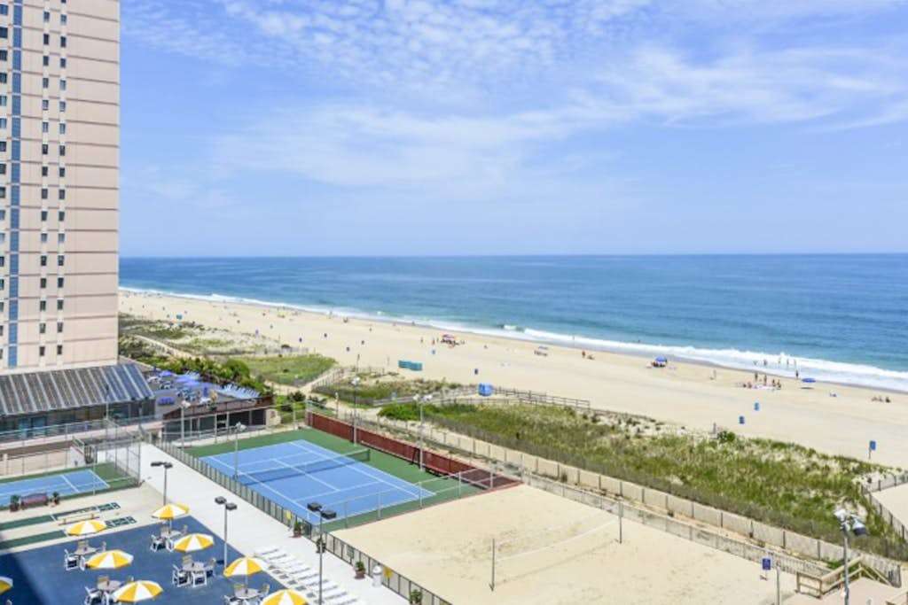 Stunning beachfront condo with beach-view balcony, pools, tennis & gym